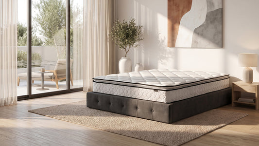 Quilted mattress on black bed base in bright neutral bedroom