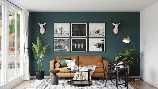 Stylish living room with a teal accent wall, brown sofa, and gallery wall, illustrating common decorating mistakes to avoid in interior design.