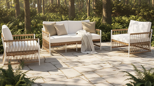 Outdoor lounge set with rope detail and cream cushions on garden patio