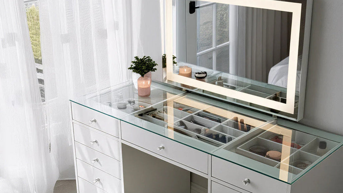  A close-up shot of a modern, white dressing table with a clear glass top, showcasing organized drawers beneath. The table has multiple storage drawers with crystal-like knobs. 