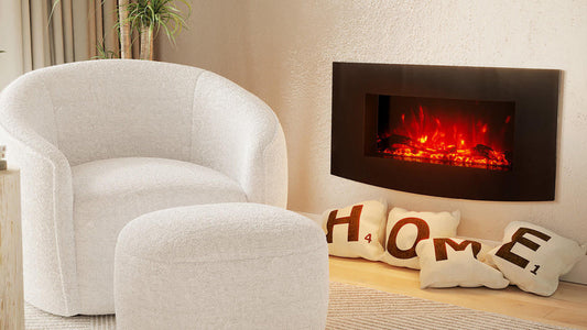 Wyoming 90cm Free Standing LED Electric Fireplace in Black, wall-mounted above a cozy armchair and ottoman, glows warmly with ember-red flames, enhancing a stylish, contemporary living-room nook.