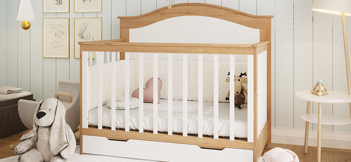 A cozy nursery corner featuring a wooden baby crib with a pink heart pillow and plush reindeer, flanked by a stuffed dog, side table, and a warm-lit floor lamp.