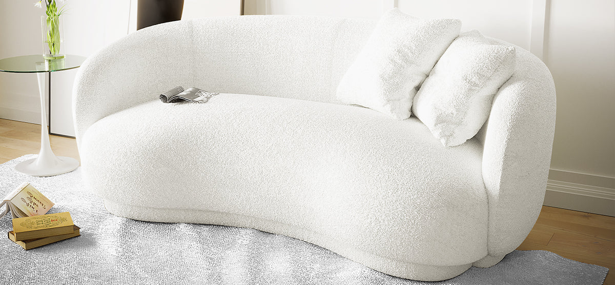 Janelle 213cm Curved Bouclé 3.5-Seater Sofa - Cream White, featuring a luxurious curved design and plush bouclé fabric, displayed in an elegant indoor setting, highlighting its spacious and sophisticated appeal.