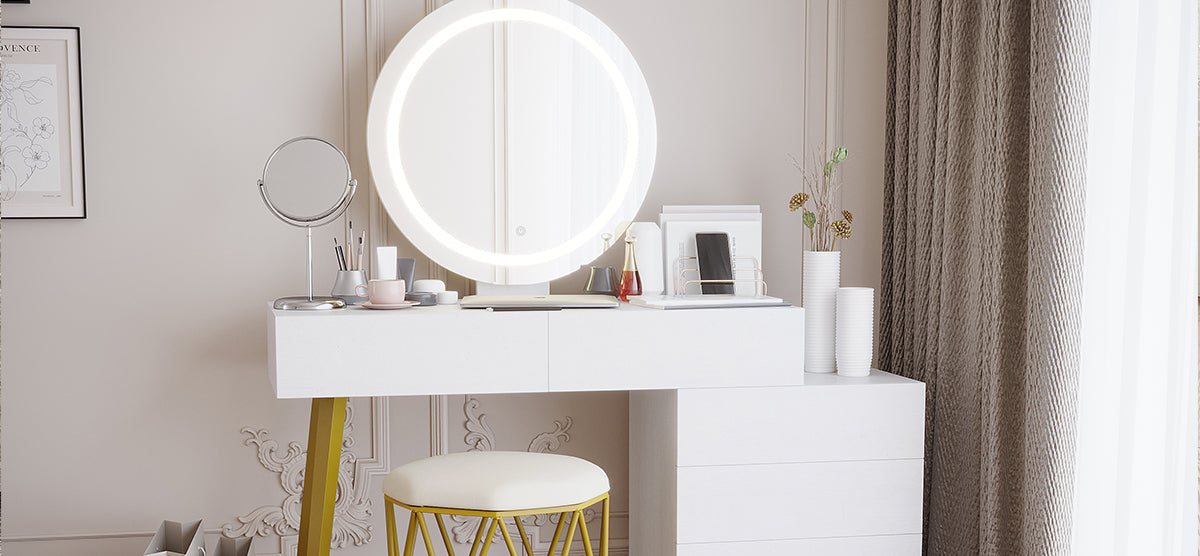 Minimalist vanity setup with a circular LED-lit mirror, makeup brushes, a coffee cup, and smartphone stand. Modern stool with gold legs in front. Elegant décor and ornate wall molding.