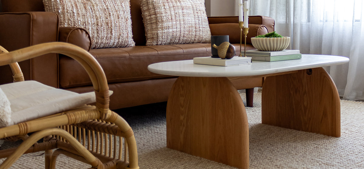 Kerry 120cm Solid Oak Oval Coffee Table - White Natural featuring a sleek white tabletop, sturdy natural oak legs, and anti-slip pads, ideal for modern living room settings.