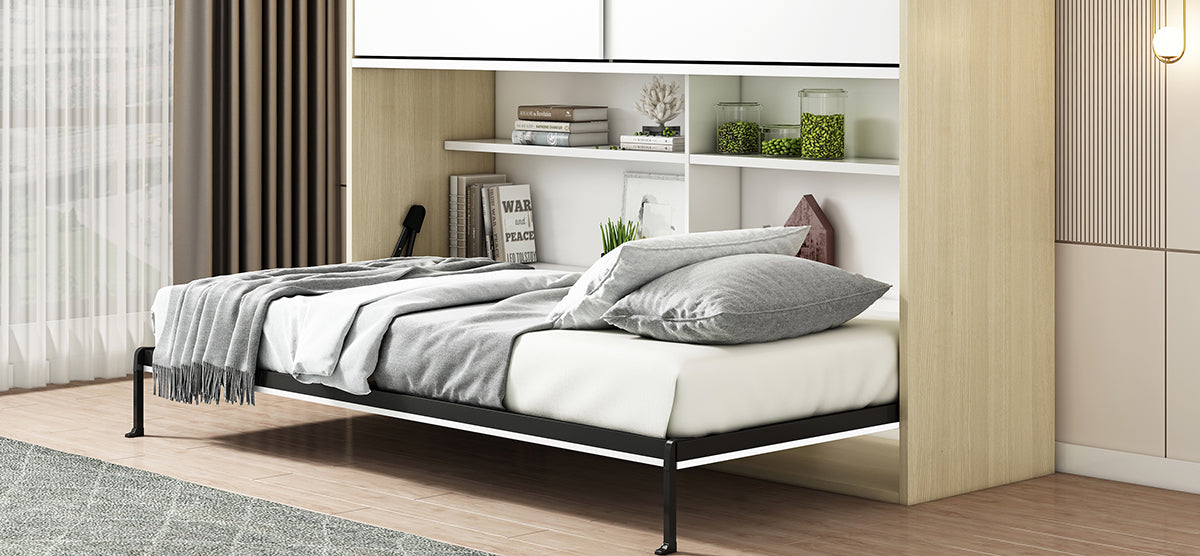 Modern minimalist bedroom with a wall-mounted Murphy bed, black metal frame, light gray sheets, and throw. Built-in shelving with decor items, large window, and light wood floor.