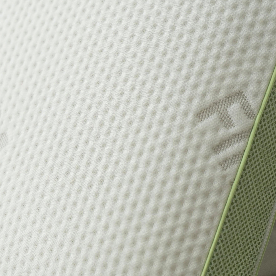 Close-up of the Tencel jacquard fabric weave with the green gusset edge visible