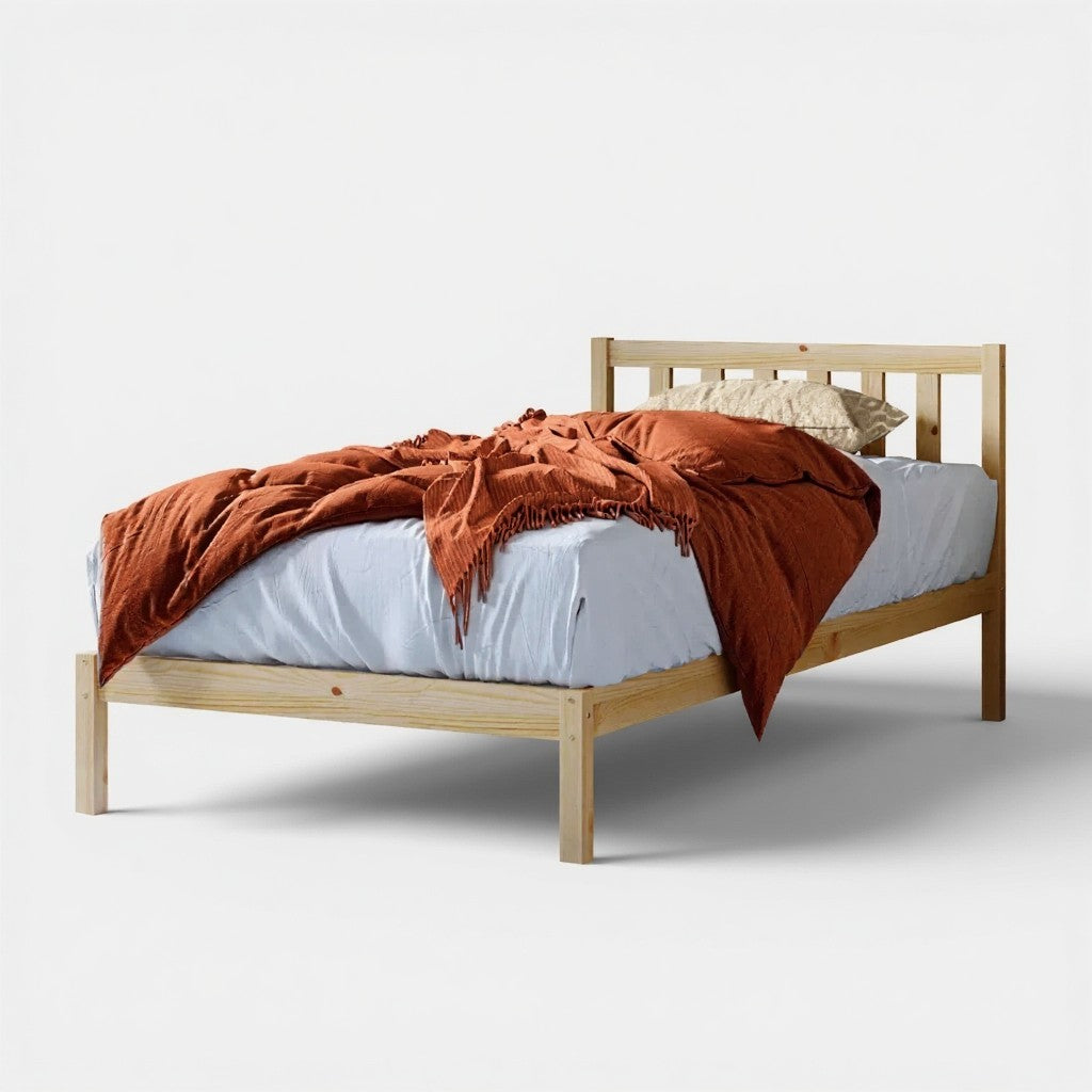 Drusa Single Solid Pine Wooden Bed Frame in Natural, featuring a simple wooden design with a white fitted sheet, rust-orange throw blanket, and single pillow, showcasing its minimalist yet versatile appeal.