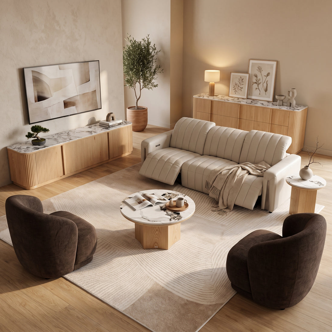 Cream leather recliner sofa with headrests extended, paired with two brown armchairs, a marble coffee table, and a matching sideboard in a modern living room setting.