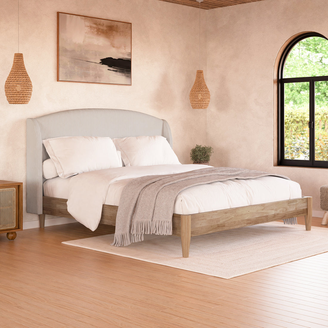 Close-up of Aetiusa Winged Fabric Hardwood Bed Frame - Beige, showcasing the padded corduroy headboard, winged design, and sturdy hardwood frame, set against a plant and wall art backdrop.