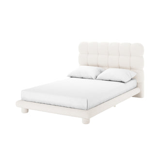 Aina Double Boucle Bed Frame in Cream White features a low-profile, upholstered design with a chunky, grid-style padded headboard, matching frame, and short cylindrical legs, showcasing elegance and comfort.