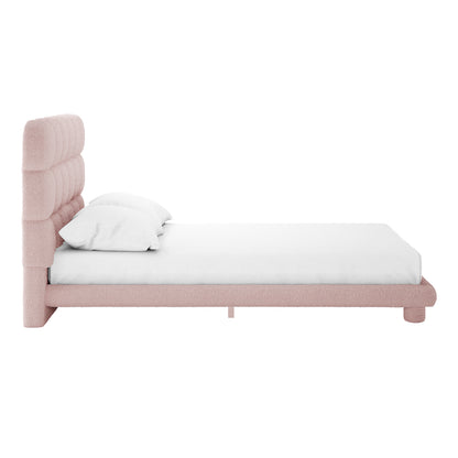 Aina Double Boucle Bed Frame in Pink, features a low-profile design with a dusty-pink tufted headboard and short cylindrical legs, set against a white background with plain white bedding.