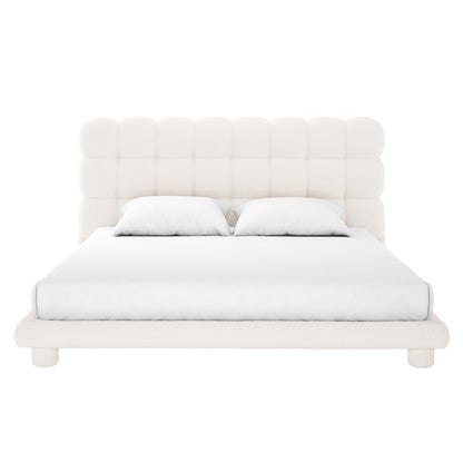 Aina King Boucle Bed Frame in Cream White, featuring a tall grid-tufted headboard and upholstered in off-white bouclé fabric, with a fitted white sheet and pillows against a plain backdrop.