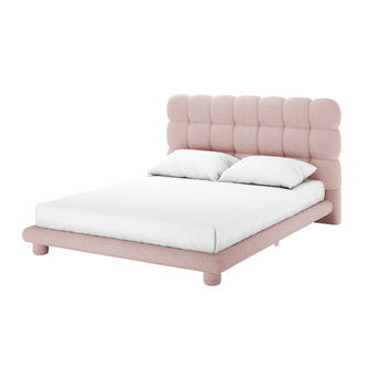 Aina Queen Bouclé Bed Frame in Pink showcases a modern platform design with a plush, tufted headboard in blush pink bouclé fabric, complemented by a minimalist rounded frame and short cylindrical legs.