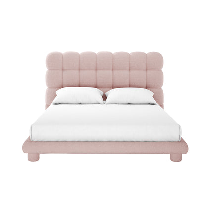 Aina Queen Boucle Bed Frame in Pink, featuring a low-profile design with a tufted headboard in soft pale pink bouclé fabric, complemented by plain white bedding and pillows.