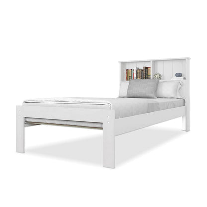 Luxo Alba Solid Pine Timber Bed Frame - White, featuring a headboard shelf with books and decor, dressed in gray bedding with three pillows, showcasing a minimalist, modern design.