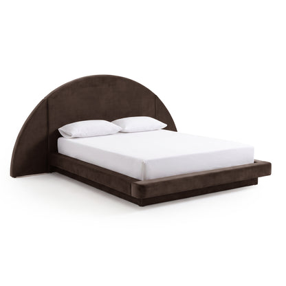 A dark brown velvet bed frame with an oversized half-moon headboard and a white mattress, isolated on a white background.