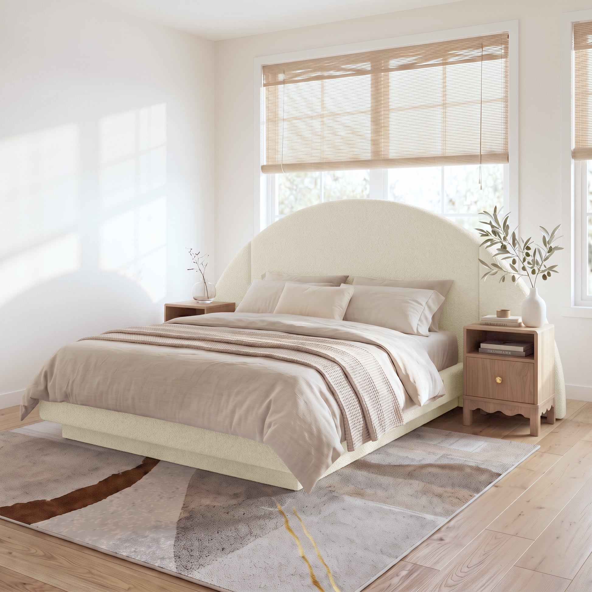 A modern neutral bedroom showcasing the Cosy Boucle Bed Frame with a statement half-moon headboard, styled with beige bedding and wooden nightstands on a textured abstract rug.