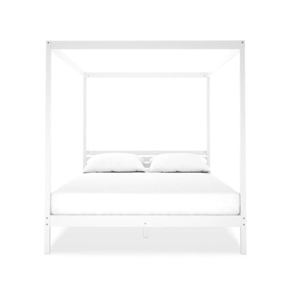 Aurelius Queen Solid Pine 4-Post Canopy Bed Frame in White, showcasing a minimalist design with vertical posts and horizontal beams, supporting a white mattress and pillows.