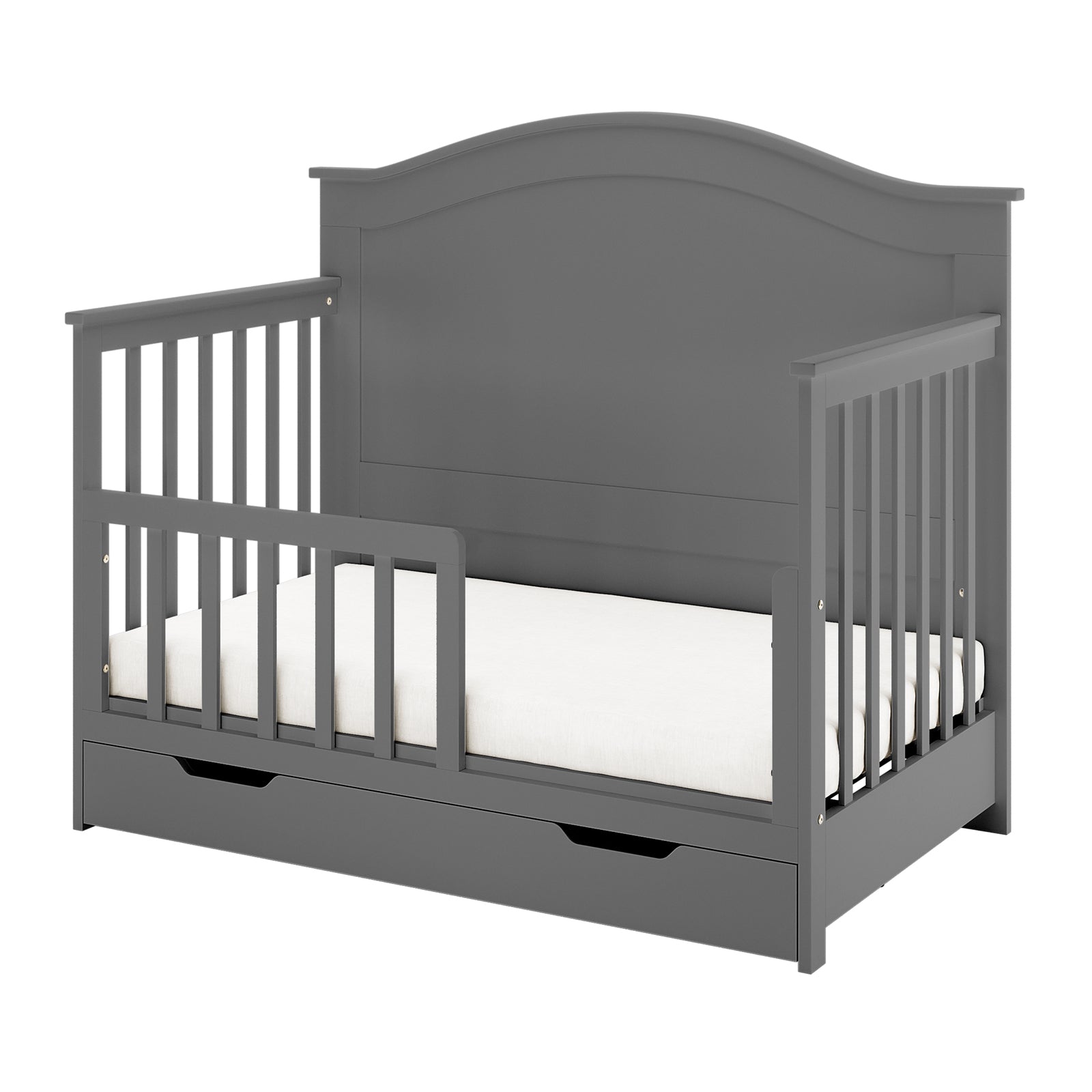 Azeem & Giro Solid Pine Convertible Cot Set in Grey, featuring a gray wooden toddler bed with partial safety rails, contoured headboard, and a pull-out storage drawer beneath the mattress.