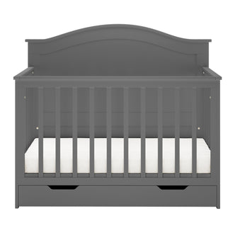 Azeem & Giro Solid Pine Baby Cot with Convertible Rail Set Grey features vertical slats, an arched headboard, white mattress, and a built-in drawer, showcasing a versatile 3-in-1 design.