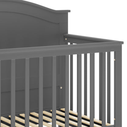 Azeem & Giro Solid Pine Baby Cot with Convertible Rail Set features a painted-wood frame with headboard, vertical slatted side rails, and mattress-supporting wooden slats, showcasing its sturdy and stylish design.