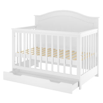 Azeem & Giro Solid Pine Baby Cot with Convertible Rail Set White features a white wooden crib with vertical slats, a pull-out storage drawer, and light wood mattress supports, showcasing its 3-in-1 versatility.