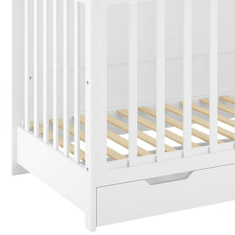 Azeem & Giro Solid Pine Baby Cot's white corner frame with vertical slats, horizontal mattress supports, and integrated storage drawer, highlighting its convertible design from a cot to a toddler bed.