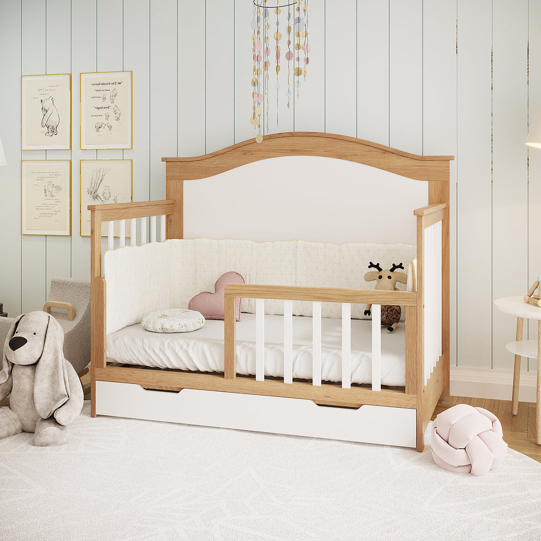Azeem & Giro Solid Pine Convertible Cot Set in Walnut Tone, featuring a low wooden-and-white design with a partially open side, white fitted sheet, padded bumper, and built-in storage drawer below.