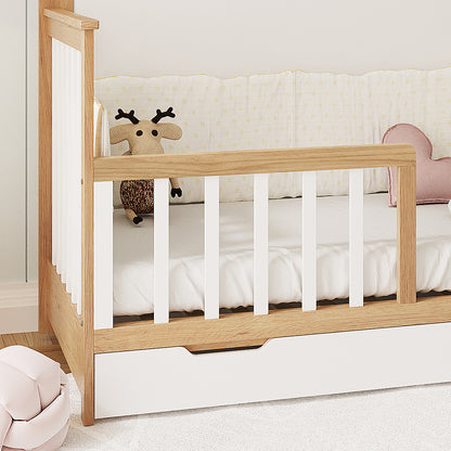 Azeem & Giro Solid Pine Baby Cot with Convertible Rail Set in white features slatted sides, a built-in storage drawer, a pink heart cushion, and a knitted reindeer plush toy on the bed.