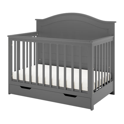 Azeem 3-in-1 Adjustable Solid Pine Baby Cot Grey featuring slatted sides, a curved headboard, a white mattress, and a pull-out storage drawer, showcasing its elegant and functional nursery design.