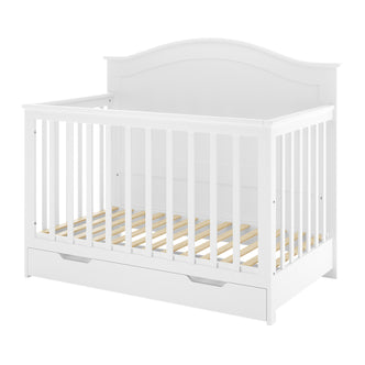 Azeem 3-in-1 Adjustable Solid Pine Baby Cot – White featuring slatted sides, an arched headboard, and a pull-out storage drawer, designed to grow with your child.