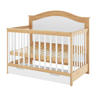 Azeem 3-in-1 Adjustable Solid Pine Baby Cot White Natural, featuring slatted sides, a curved headboard, and a built-in storage drawer, showcasing a blend of natural wood and white accents.