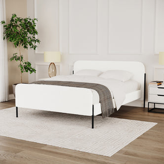 Bonny Double Boucle Fabric Bed Frame in Cream White, featuring a low-profile design with boucle-upholstered head- and footboard, set in a minimalist bedroom with white linens and modern nightstands.