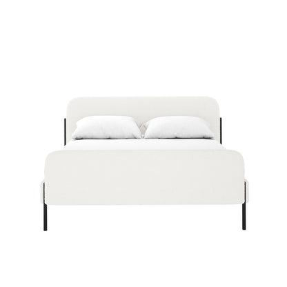Bonny Double Boucle Fabric Bed Frame in Cream White, featuring boucle-upholstered headboard, footboard, and side rails on black metal legs, dressed in white linens with two pillows against a white backdrop.