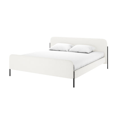 Bonny King Boucle Bed Fabric Frame in Cream White features a modern platform design with upholstered headboard and footboard, slender black metal legs, and is dressed with a white mattress cover and pillows.
