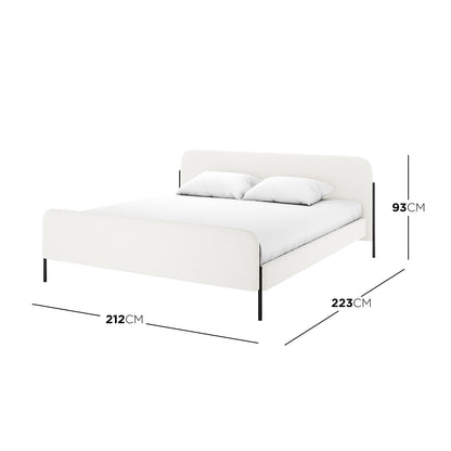 Bonny King Boucle Bed Fabric Frame in Cream White, featuring soft bouclé upholstery, a low-profile design, and sleek black metal legs. Includes dimensions and showcases a white mattress with two pillows.