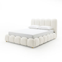 Brent double gas lift bed in boucle cream white with scalloped base, channel-tufted headboard, and gold legs