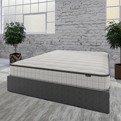 Byron & Cybele Queen Wall Bed & Mattress Package in White displayed as a low-profile bed with a quilt-textured mattress and dark gray upholstered platform, surrounded by minimalist decor and potted plants.