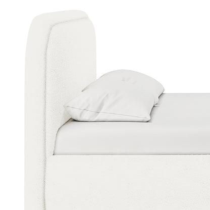 Side view of the Calix Double Boucle Bed Frame in Cream White, featuring a soft, foam-padded headboard, mattress, and pillow, highlighting the bed's minimalist design and elegant boucle texture.