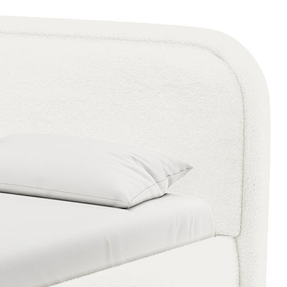 Calix King Boucle Bed Frame in Cream White, featuring a padded, rounded headboard and a neatly made mattress with a fitted sheet and pillow, showcasing its soft boucle upholstery and elegant design.