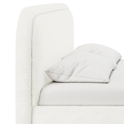 Calix King Boucle Bed Frame in Cream White featuring a padded headboard, mattress, and two pillows. Showcases modern, all-white upholstery with sleek, low-rise design for a luxurious and sophisticated bedroom look.