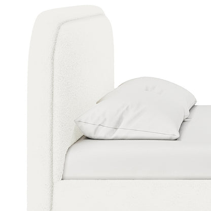 Calix Queen Boucle Bed Frame in Cream White, showcasing a close-up of the upholstered headboard and side rail, with a white mattress and pillow, highlighting its modern low-rise design and foam-padded comfort.
