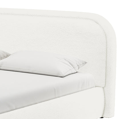 Close-up of the Calix Super King Boucle Bed Frame in Cream White, highlighting the upholstered headboard and side rail with mattress and pillow, showcasing its elegant, modern design.