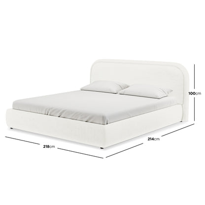 Calix Super King Boucle Bed Frame in Cream White features a rounded headboard, upholstered in boucle fabric, with a fitted mattress and two pillows, dimensions shown: 218 cm wide × 214 cm deep.