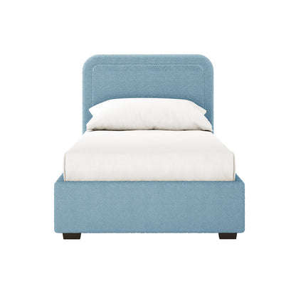 Carya Kids Single Fabric Boucle Bed Frame in Blue features a low upholstered frame, matching headboard, and plain white bedding, offering a cozy, modern design ideal for children's bedrooms.