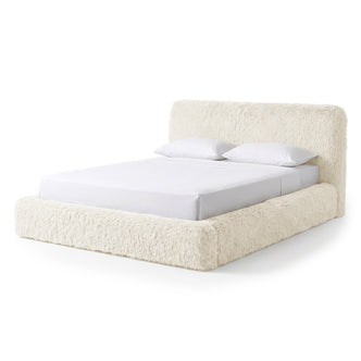 Modern plush upholstered bed shown fully on a white background