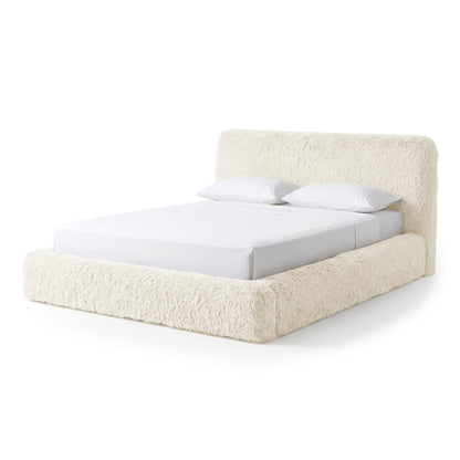 Cream shaggy upholstered bed on a white background.