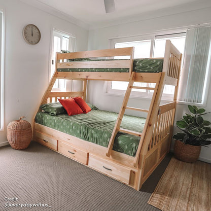 Cornelia Storage Triple Bunk Bed - Natural Solid Wood shown with integrated ladder, full-length guard rails, and three spacious under-bed drawers, offering a practical and stylish solution for shared spaces.
