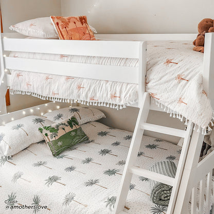 Cornelia Storage Triple Bunk Bed - White Solid Wood, showcasing a sturdy triple bunk design with integrated storage drawers, crafted from durable pine, featuring a solid wood ladder and guard rails for safety.